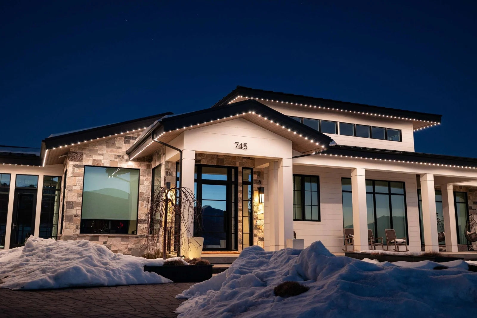 Permanent outdoor lighting on a home at night